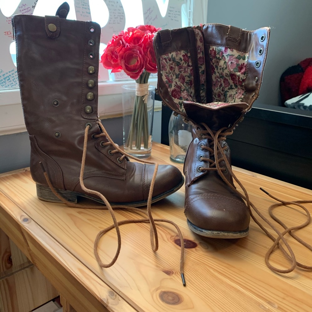Gently worn brown combat boots with floral pattern